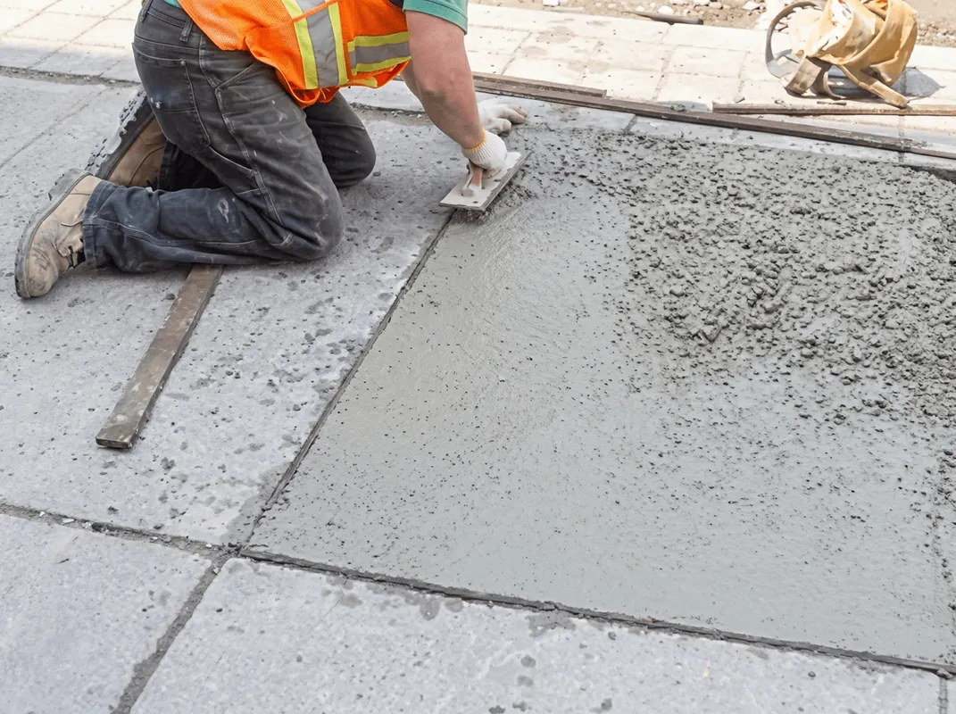 Professional repairing a concrete floor in Cincinnati, OH